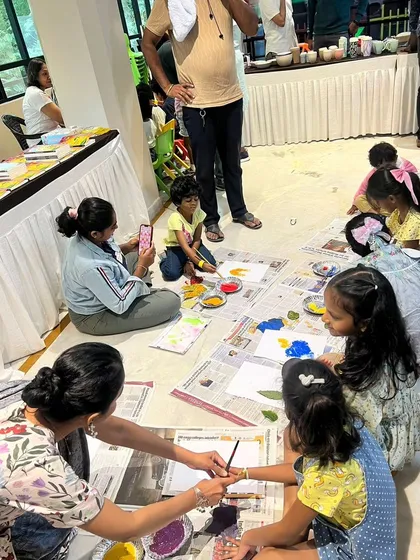 Children and parents are engrossed in a hands-on craft activity during our Lit Fest, making art inspired by the stories they heard.