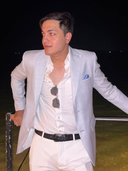 This Arctic Blue linen jacket is a client favorite for destination weddings and day events. It's seen here styled for an evening by the water, proving its versatility from day to night.