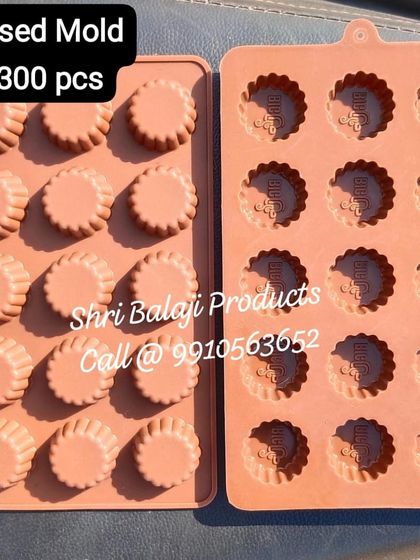 Here are two versions of a custom silicone mold for a client. One side creates a fluted-edge circular product, while the other embosses their "BUD" logo, offering great versatility from a single order.