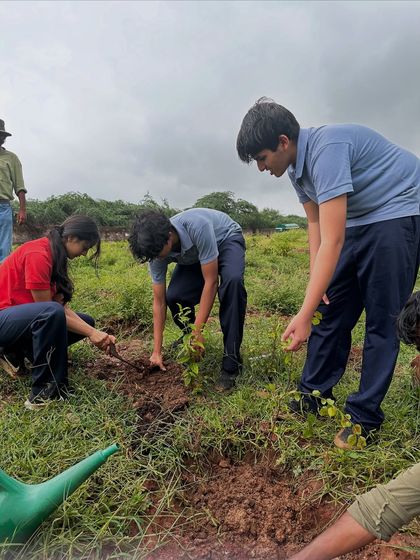 Under a cloudy sky, students from The Shri Ram School work together to plant saplings at Aravali Nagar Van. This was climate action done right: right species, right place, right time.