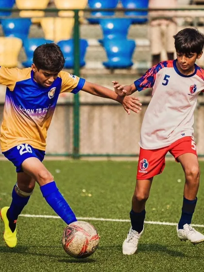 An intense moment from the U13 quarterfinal match against Thane City FC, with our player shielding the ball.