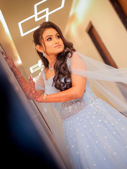 A stylish portrait of the bride-to-be in a beautiful blue gown.