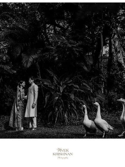 A beautiful black and white shot capturing the essence of a Coorg wedding tradition. The focus is on the moment and the bride's serene expression, a testament to a look that is timeless beyond colour.