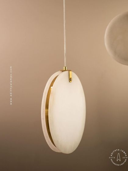 Showcasing our disc-shaped marble pendants. The light emanates softly through the thin slice of natural marble, revealing its unique veining. These fixtures are available in different shapes and look stunning hung in pairs or trios.