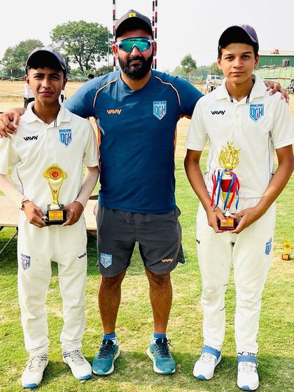 Dev Ahlawat (Man of the Series) and Noor Mohammad (Best Wicket Keeper) with their trophies.