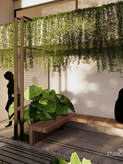 The forecourt of the Waterfront House connects the property's different zones. We used clean lines, simple wooden benches, and cascading greenery to create a welcoming and serene transition space that sets a tranquil tone upon entry.