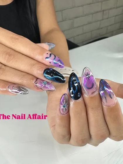 A galaxy-inspired design using a multi-chrome base that shifts between purple, blue, and black, with silver accents.