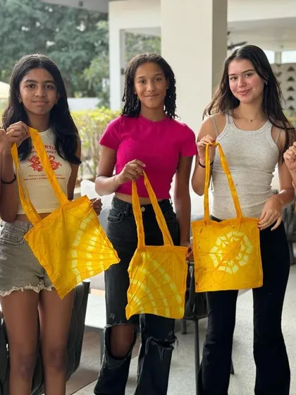 A birthday party filled with creativity and sunshine. These girls celebrated by learning the art of tie-dye, using a natural dye bath made from marigold petals. Each one left with a bright, beautiful tote bag they designed themselves.