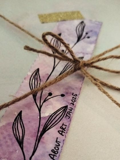 Even the smallest details are made with love. A hand-painted watercolor bookmark, tied with jute string, ready to be sent out with a larger order.