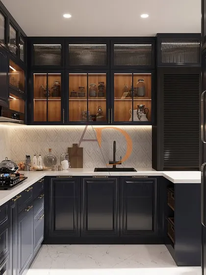 This U-shaped modular kitchen showcases a sophisticated blend of rich navy blue PU-finished cabinetry and warm wood tones. Features like fluted glass shutters, under-cabinet LED lighting, and a clean white quartz countertop demonstrate a perfect balance of luxury and high-functioning kitchen design.