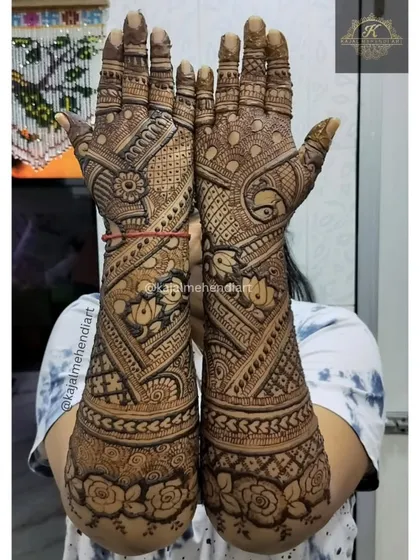 A full and heavy bridal design for the groom's sister. The pattern is dense with traditional motifs, ensuring the hands look beautifully adorned for the wedding festivities.