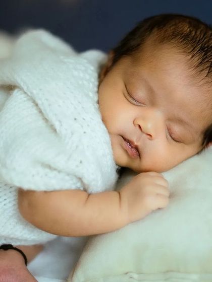 In this close-up, you can see the soft texture of the hooded outfit we provide for the 'Blue Moon' theme. It keeps the baby cozy and adds to the dreamy look.