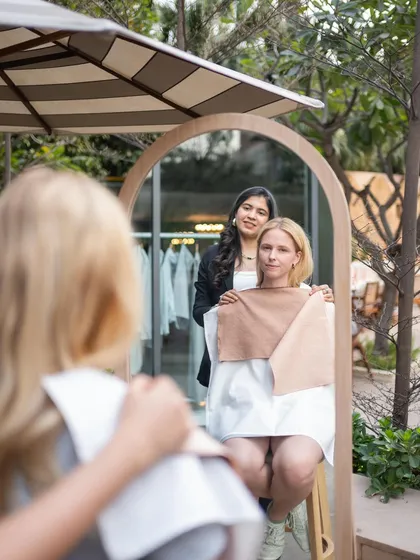 This is the moment of discovery. After draping, the client can see for herself in the mirror how a particular color brings out a glow in her skin. My job is to guide this discovery and explain why certain shades work so well.