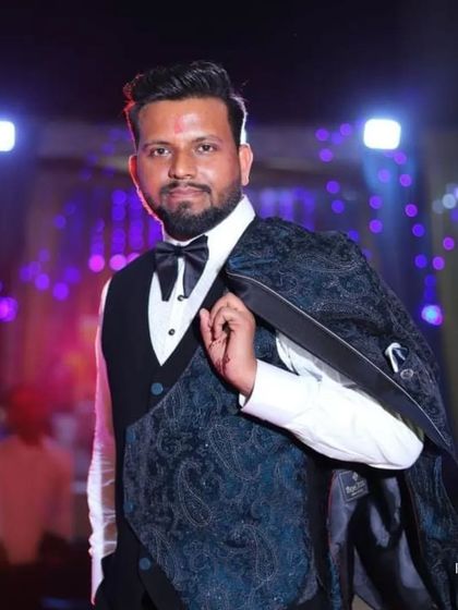 The client casually draping his tuxedo jacket over his shoulder, a picture of effortless style and confidence.