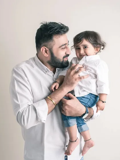 A quiet conversation between father and child. The way they look at each other in this portrait speaks volumes about their special bond.