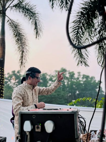 In the zone during a daytime Baraat, with palm trees in the background. The vibe is always immaculate.