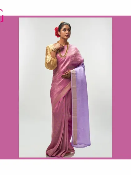 This full-length portrait shows the graceful drape of the pink and lavender silk linen saree, an embodiment of timeless elegance.