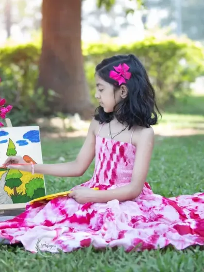 Letting a child's imagination run free is pure magic. For my creative sessions, I bring along props like easels and paints to capture your little artist as they create their own masterpiece in the park.
