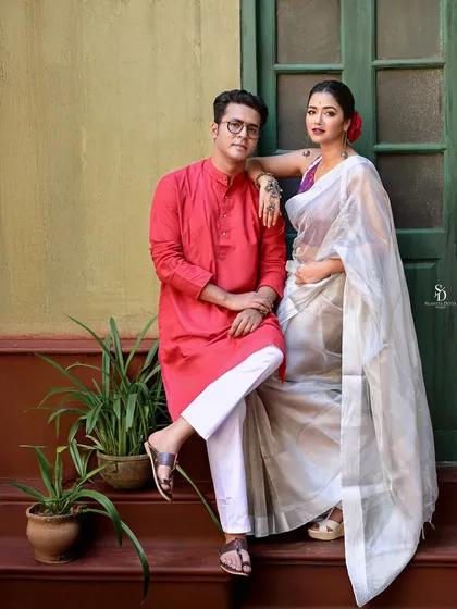 Actors Anirban Bhattacharya and Sohini Sarkar in a quiet moment for a Sangbad Pratidin shoot. The setting on the steps of a classic Kolkata house adds a layer of nostalgia and authenticity to their portrait.
