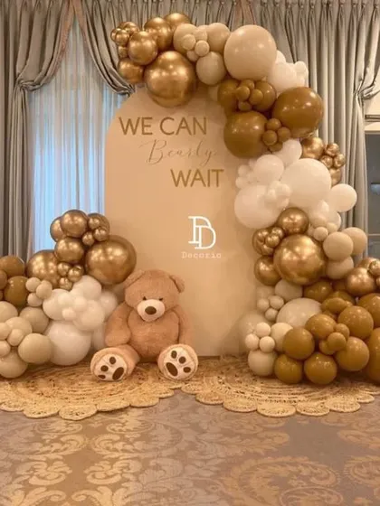 This is an example of my popular "We Can Bearly Wait" teddy bear theme, designed with a chic and modern neutral color palette. The combination of white, beige, and chrome gold balloons creates a sophisticated and warm look for any baby shower.