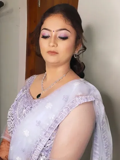 A close-up of the sangeet makeup, featuring shimmery lilac eyeshadow and a flawless base.