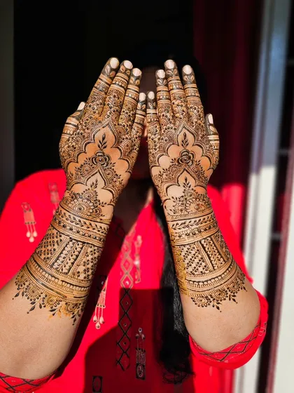 A full view of the design, with the bride playfully hiding her face.