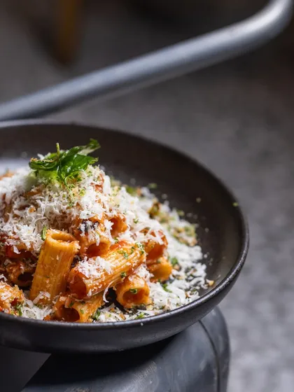 There's nothing a bowl of yummy pasta can't fix. Here's my delicious Rigatoni with a rich Arrabbiata sauce, generously topped with Parmesan.
