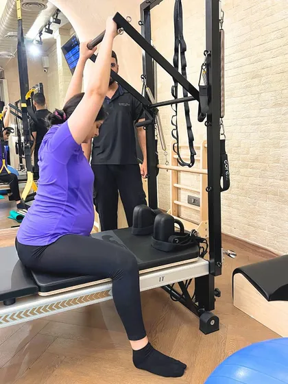 Building upper body strength is crucial during pregnancy. We use equipment like the tower to provide support and resistance, allowing for safe and targeted exercises.