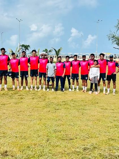 Our team in pink jerseys lines up on the field before a Kanga League match, ready for the day's competition.