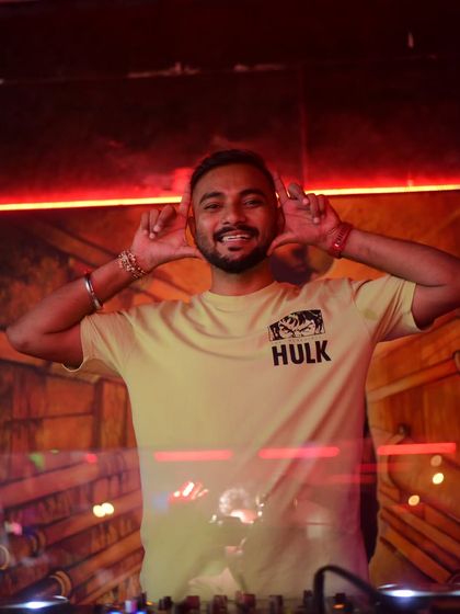 Framing the moment with a smile. Every night is a new picture, a new memory to create for the people on the dance floor.