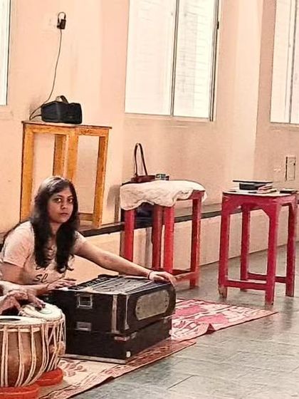 The synergy between dancer and musician is vital in Kathak. Here, I am guiding a student through a piece with live tabla and harmonium accompaniment.