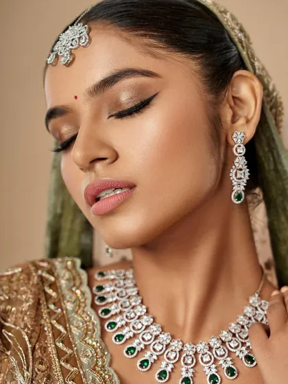 A beautiful profile shot showing the seamless blend of the eyeshadow and the radiant highlight on the cheekbones. This is key for creating a flawless bridal look from every angle.