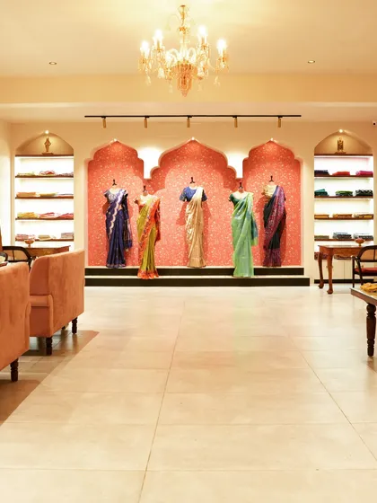 This wide view of the 'House of Vaarasa' boutique showcases our approach to retail design. We created an inviting, luxurious atmosphere with soft lighting, plush seating, and elegant archways that draw customers in and highlight the beauty of the handloom sarees on display.