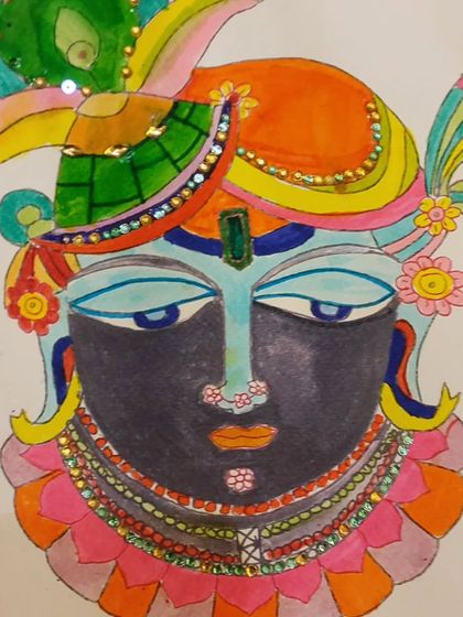 A close-up of a Lord Krishna painting in the Pichwai style. The use of bright colors and sparkling sequins makes this piece truly special.