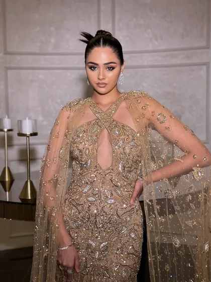 A perfect bridesmaid look for a sangeet or cocktail party. This stunning gold embellished gown by Amit GT is the ideal blend of elegance and glamour, ensuring you shine without outshining the bride.