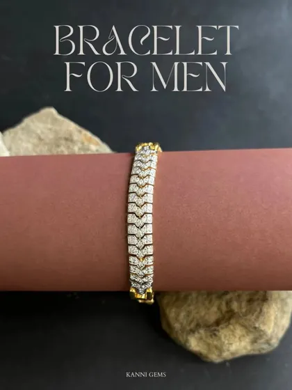 This men's bracelet features a distinctive, diamond-paved chevron pattern set in gold. It is designed for a comfortable, smooth fit, making it a versatile piece that transitions effortlessly from a day at the office to an evening out.