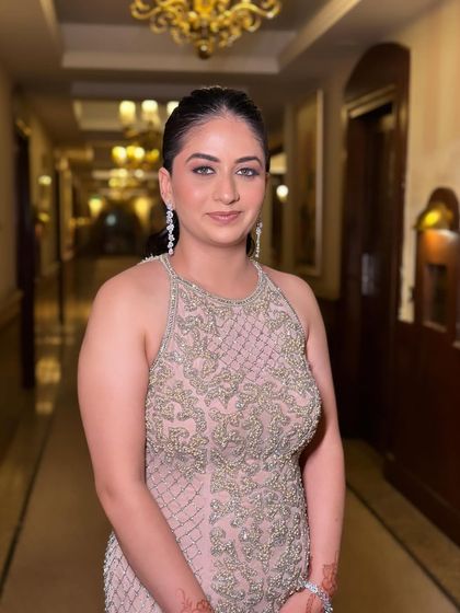 A sleek and wavy ponytail for a guest at an evening function.