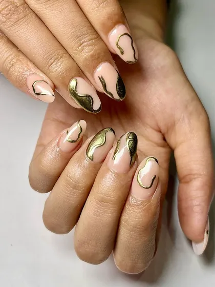 Gold chrome can be used in so many creative ways. Here, I've used it to create abstract, molten-gold shapes over a sheer nude base for an artistic and luxurious design.