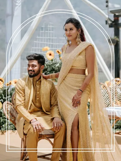 The couple looking elegant and happy during their Haldi ceremony in Rishikesh. The coordinated yellow outfits and the scenic background make for a beautiful portrait.