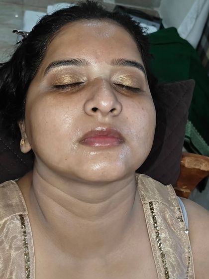 A close-up of the eye makeup before the final touches. You can see the beautiful gold shimmer on the lids.