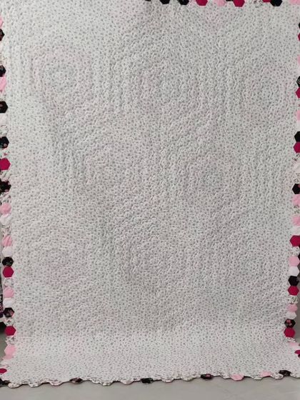 The back of the hexagon quilt, showing the intricate quilting.