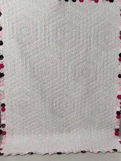 The back of the hexagon quilt, showing the intricate quilting.