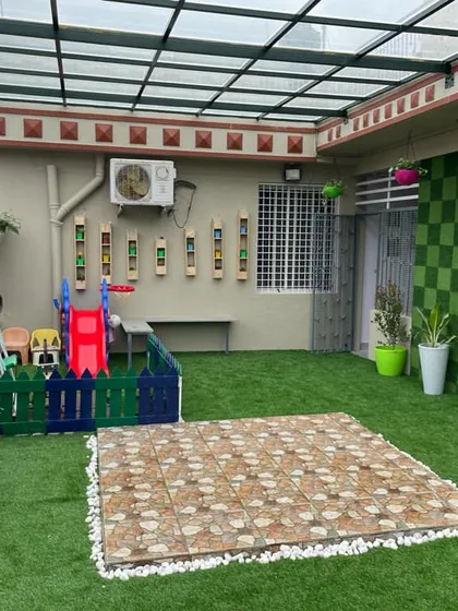 This project shows a complete terrace transformation into a child-friendly play zone. We used artificial turf for safety and durability, and added wall-mounted planters and a checkerboard green wall to make the space vibrant and fun.