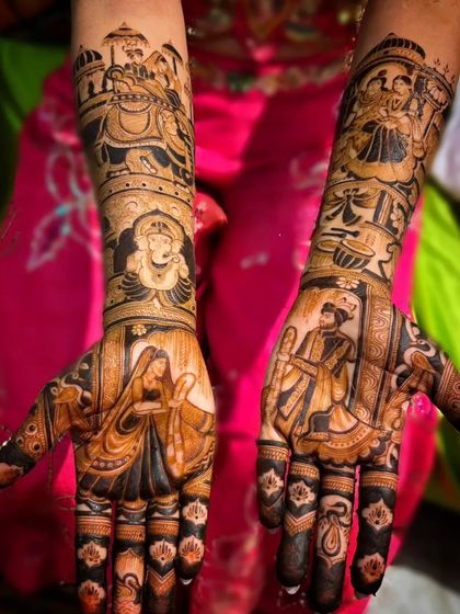 A narrative bridal mehandi featuring multiple scenes. The design includes a doli, Ganesha, musicians, and portraits of the bride and groom, creating a vibrant story.
