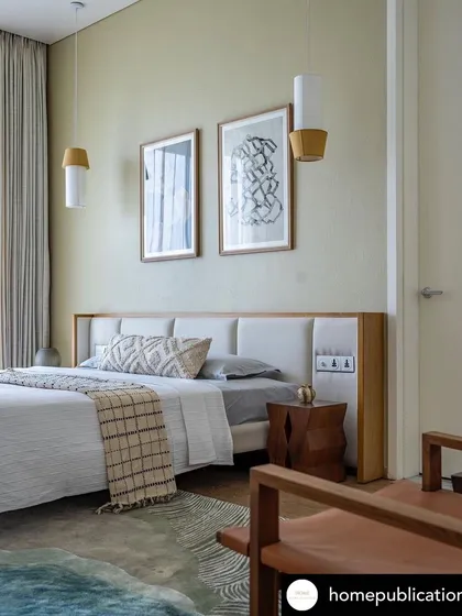 My framed ink drawings featured in a Pune home by Radhika Utpat Studio. These minimalist, abstract line works add a touch of graphic sophistication above the bed.
