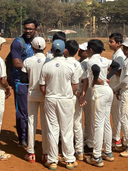 Mentorship is at the core of what we do. A coach huddles with our U12 cricket team during the Bhaskar Thakur Memorial Trophy, providing strategic guidance and building the team spirit essential for success on and off the field.