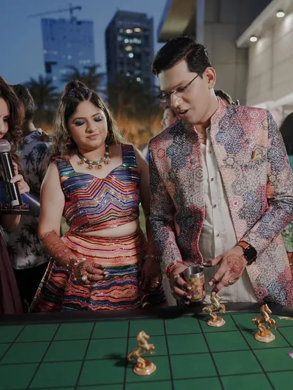 The couple trying their luck at a game stall during their carnival-themed Mehendi. I love incorporating fun activities that allow the couple to interact and have fun.