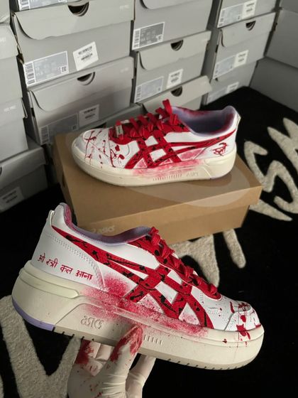 Actress Shraddha Kapoor wearing custom ASICS sneakers themed for her movie "Stree 2," featuring blood-splatter details.