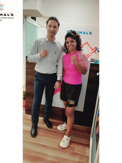 Dr. Vimal with pro MMA fighter Priya "The Catwoman" Sharma at our clinic. We are delighted to be her official physiotherapy partner, helping her prepare for her strawweight fight campaigns.