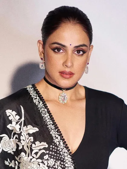 The gorgeous Genelia D'Souza wearing my handcrafted cherry blossom earrings and a hummingbird with roses choker pendant. Her monochrome look makes the colours of the jewellery truly stand out.